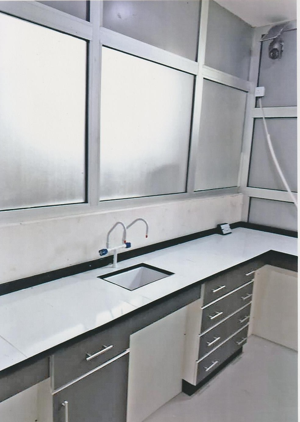 Corner sink station with drawer and cabinet storage