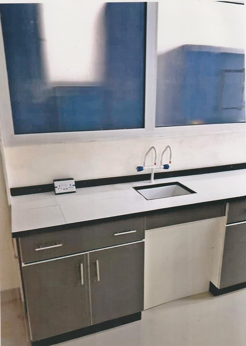 Corner workstation with wall-mounted AC and cabinetry